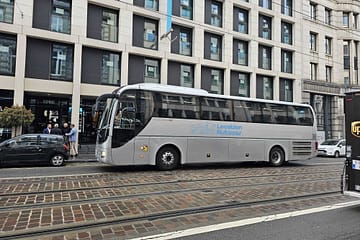 Belgique , bruxelles le 7 mars 2024 une bus gris devant un hotel